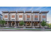 Modern townhomes with brick and wood accents and well-manicured landscaping at 777 Willard St, Durham, NC 27701
