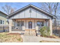 Charming craftsman-style home with stone accents, a covered porch, and a welcoming entrance at 723 Holloway St, Durham, NC 27701