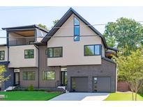 Stunning modern home showcasing unique architectural elements and a well-manicured lawn at 1406 Lyon St # 101, Raleigh, NC 27608