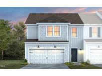 Charming two-story home featuring an attached garage, gray siding, and a well-maintained front yard at 3404 Pelican Ln, Durham, NC 27703