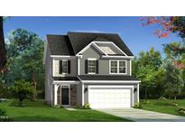 Charming two-story home with gray siding, a covered porch, and a two-car garage at 542 Winding Crk Dr, Lillington, NC 27546