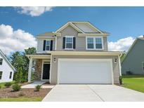 Charming two-story home featuring a two-car garage and stone accents at 542 Winding Crk Dr, Lillington, NC 27546