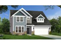 Charming two-story home featuring a stone foundation, stylish siding, a two-car garage, and a well-manicured lawn at 143 Sugar Pine Drive, Franklinton, NC 27525