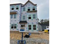 Exterior view of home under construction highlighting window placement and future architectural style at 304 Chesapeak Commons St # 146, Garner, NC 27529