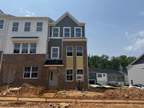 Newly constructed two-story townhouse featuring a brick facade with multiple windows and an inviting entryway at 304 Chesapeak Commons St # 146, Garner, NC 27529