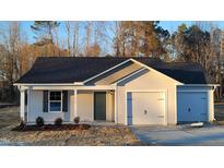 Charming single-Gathering home with a two-car garage and well-manicured front yard at 3724 Josiah Ct, Nashville, NC 27856