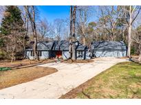 Charming home with a well-manicured front yard and a spacious driveway at 105 Old Lowery Ct, Raleigh, NC 27614