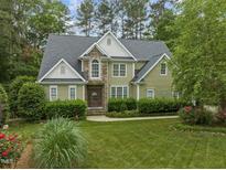 Charming two-story home featuring a beautifully landscaped front yard and inviting stone accents at 119 Patterson Dr, Youngsville, NC 27596