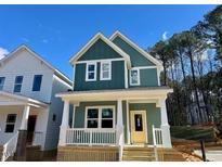 Charming two-story home with a cozy porch, perfect for enjoying the outdoors at 120 Weavers Grv Dr, Chapel Hill, NC 27514