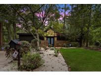 Charming single-Gathering home featuring professional landscaping and a brick facade at 225 Woods Ream Dr, Raleigh, NC 27615