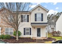 Charming two-story home with classic shutters and well-maintained front yard landscaping at 3349 Tarleton W, Durham, NC 27713