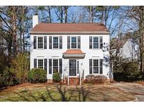 Charming two-story home with a classic design, featuring a well-manicured front yard at 105 Solstice Cir, Cary, NC 27513