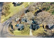 An aerial view of a neighborhood showcasing houses, mature trees, and lawns at 2867, 2851 Nc-210 & Galilee Hwy, Smithfield, NC 27577