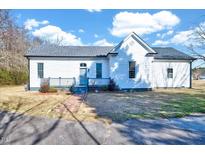 Charming, renovated one-story home with white siding and a welcoming front porch at 57 Lowell Ct, Smithfield, NC 27577