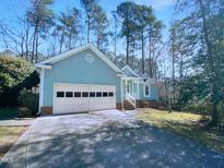 Charming one-story home with a two-car garage and inviting front porch at 1010 Mingo Pl, Knightdale, NC 27545
