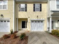 Charming townhome featuring a well-maintained exterior and a one-car garage at 10805 Cheery Knl, Raleigh, NC 27614