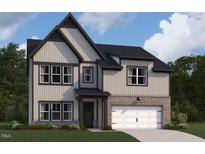 Charming two-story home featuring a two-car garage and a well-manicured lawn at 167 S Harvest Ridge Way # Homesite 223, Clayton, NC 27520