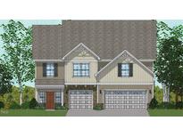 Charming two-story home with a stone and siding exterior and a two-car garage at 235 Augusta Pond Way # 161, Raleigh, NC 27603