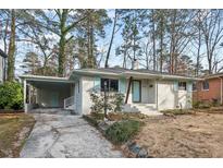 Charming brick home with a carport and light-blue accents at 2603 Legion Ave, Durham, NC 27707