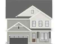 Charming two-story home with attached garage and covered front porch, showcasing a classic design and curb appeal at 268 Murray Grey Ln, Wake Forest, NC 27587