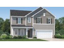 Charming two-story home with stone accents, a two-car garage, and a welcoming front porch at 601 Morning Light Dr, Angier, NC 27501