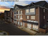 Attractive brick building with balconies, garage doors, and charming architectural details at 1400 Gathering Park Cir # 304, Cary, NC 27519