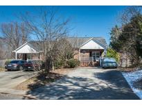 Charming brick home with a covered front porch and well-maintained landscaping at 2203 Eider Ct # A, Graham, NC 27253