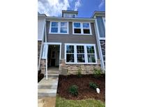 Charming townhome exterior featuring stone accents, neutral siding, and a welcoming entrance at 332 Church St # 45, Wendell, NC 27591
