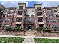 Attractive brick condominium building with multiple floors and balcony access at 700 Finsbury St # 304, Durham, NC 27703