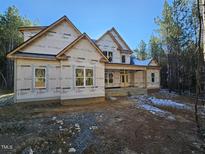 New construction home showing framing on exterior walls with windows installed at 98 Fox Oak Trl, Pittsboro, NC 27312