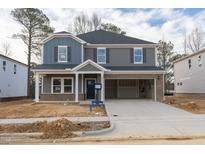 New construction two-story home with a two car garage and craftsman details at 3821 Rosebush Dr, Zebulon, NC 27597