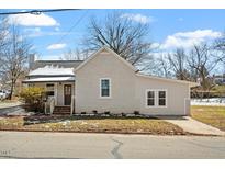 Charming single Gathering home featuring a well-manicured lawn and inviting front entrance with brick steps at 410 N Lamar St, Roxboro, NC 27573