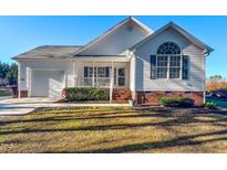Charming single Gathering home with a well manicured front yard and covered porch at 2105 Antioch Church Rd, Timberlake, NC 27583