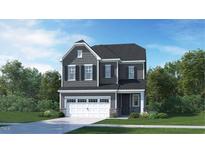 Charming two-story home with stone accents, a two-car garage, and a beautifully landscaped front yard at 641 Emerald Bay Cir, Raleigh, NC 27610