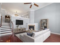 Inviting living room with a cozy fireplace, plush seating, and elegant decor for comfortable living at 10321 Sablewood Dr # 108, Raleigh, NC 27617
