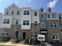 Newly built townhomes feature brick facades and multiple windows for ample natural light at 332 Chesapeak Commons St # 141, Garner, NC 27529