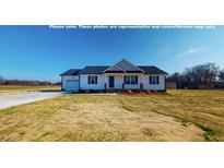 Charming single-story home features white siding, black shutters, and an attached garage at 82 Asher Pointe Way, Benson, NC 27504