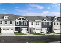 Charming townhome exteriors with a mix of light and dark facades and attached garages at 8717 Wardle Ct, Raleigh, NC 27616