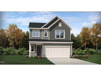 Two-story home featuring a two-car garage, gray siding, and manicured landscaping at 1010 Sora Way, Durham, NC 27703
