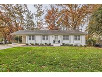 Charming home with a manicured lawn and mature trees at 212 Sampson St, Raleigh, NC 27609