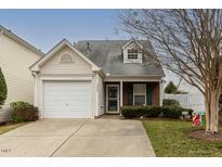 Charming single-Gathering home with a well-maintained lawn and attached single car garage at 5420 Golden Moss Trl, Raleigh, NC 27613