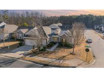 Charming single-Gathering home with a well-manicured lawn and an attached two-car garage at 1100 Gaston Manor Dr, Durham, NC 27703
