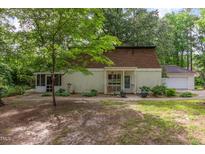 Charming home with a screened porch, mature trees, and inviting curb appeal at 214 Woodcrest Ave, Smithfield, NC 27577