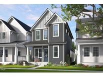 Charming two-story home featuring a welcoming front porch and gray siding, complemented by a well-manicured lawn at 502 Yeowell Dr, Chapel Hill, NC 27514