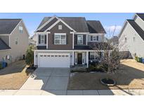 Charming two-story home with a welcoming front porch and a two-car garage at 917 Sequoia Ridge Dr, Fuquay Varina, NC 27526