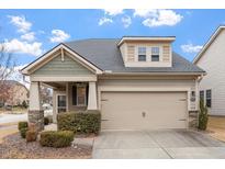 Charming home with a two-car garage, stone accents and manicured landscaping providing great curb appeal at 1003 Branwell Dr, Durham, NC 27703