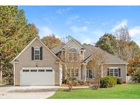 Charming single-Gathering home featuring a two-car garage and well-manicured lawn at 215 Oak Island Ct, Garner, NC 27529