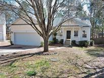 Charming one-story home with a landscaped front yard and a welcoming entrance porch at 8 Weeping Beech Way, Durham, NC 27713