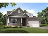Charming single-Gathering home with stone accents, a covered porch, and a well-manicured lawn at 1633 Wareham Dr, Mebane, NC 27302