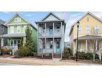 Charming two-story home with a double front porch and vibrant turquoise doors in a desirable neighborhood at 2098 Great Ridge Pkwy, Chapel Hill, NC 27516